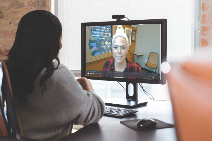 Image of an aveda institute portland admissions representative speaking virtually with a prospective student