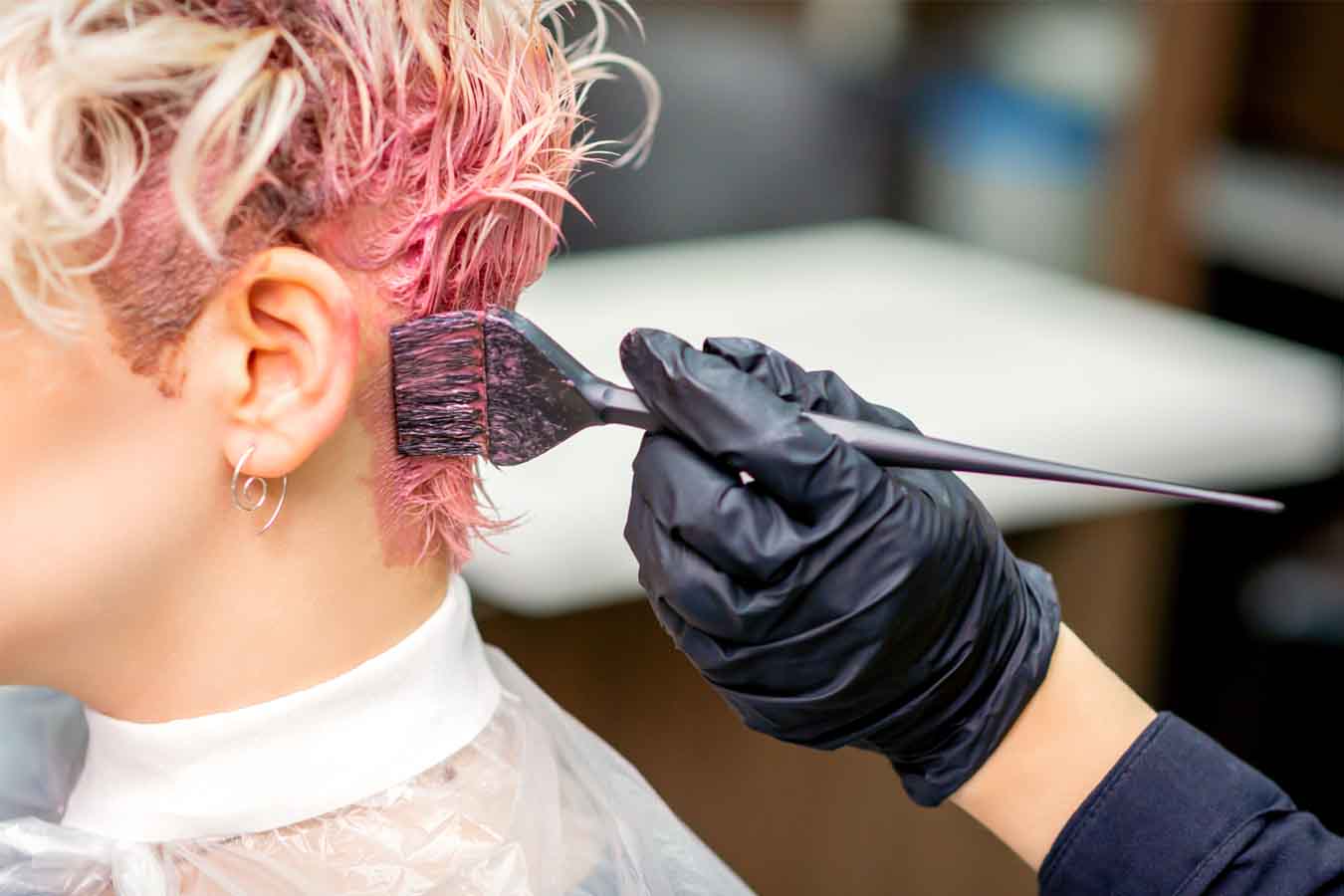Student applying color at aveda institute portland