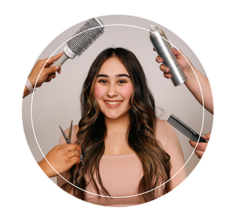image of a student at aveda institute portland surrounded by products and tools used in the hair design program
