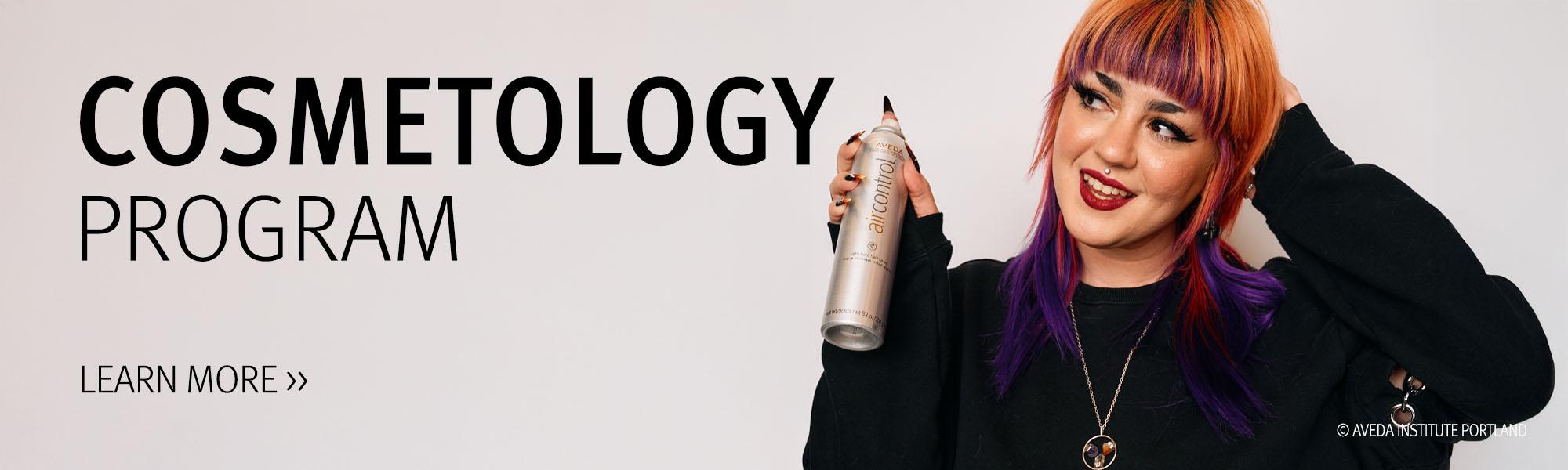 Image of a Aveda student holding a can of Air Control hair spray for the Cosmetology program