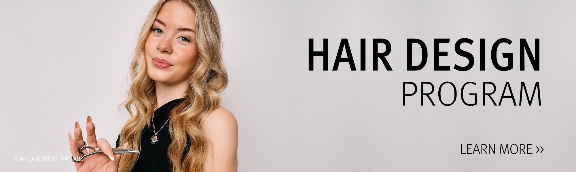 image of an Aveda Student holding scissors in the hair design program