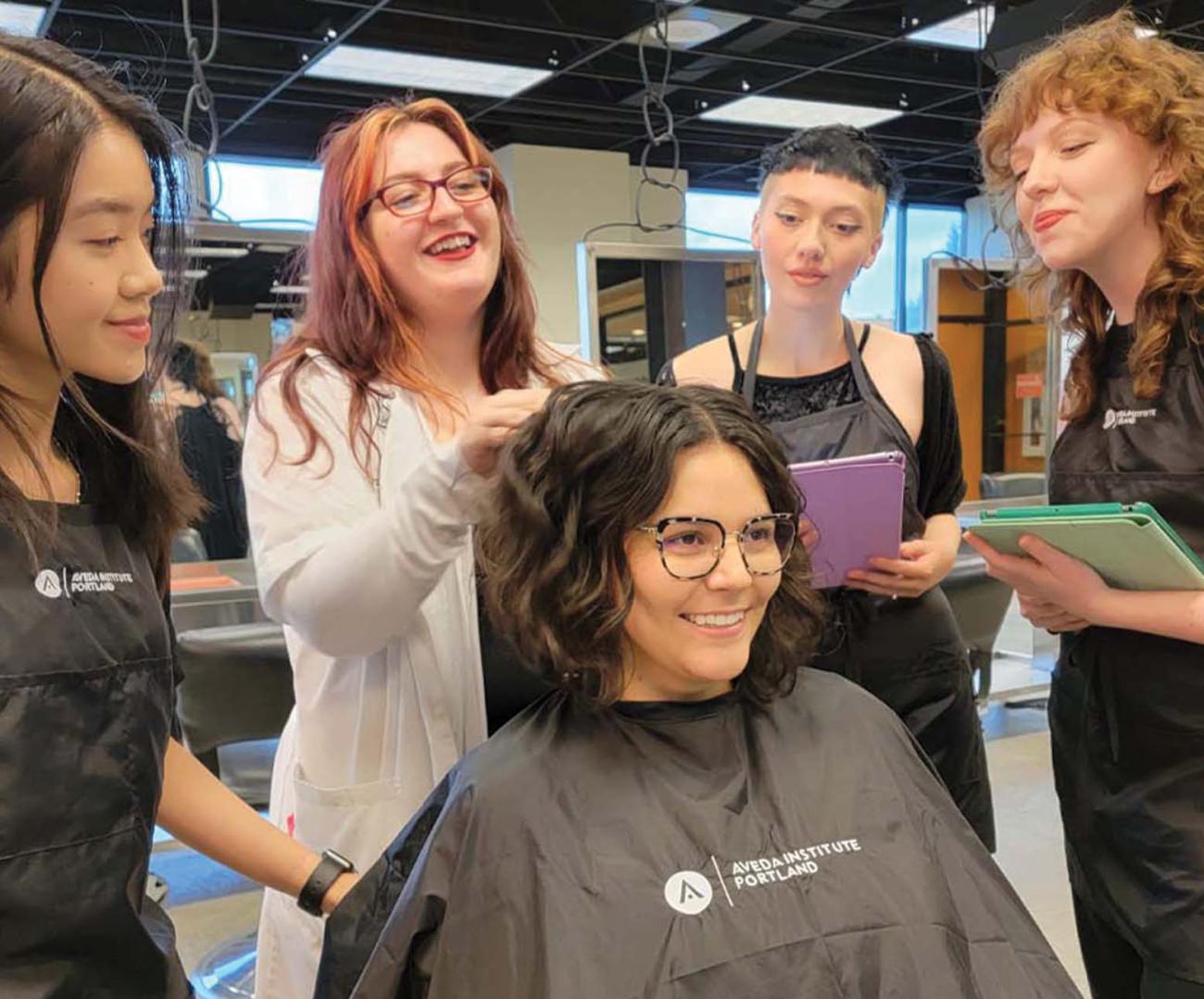 image of students and instructors in the hair design program